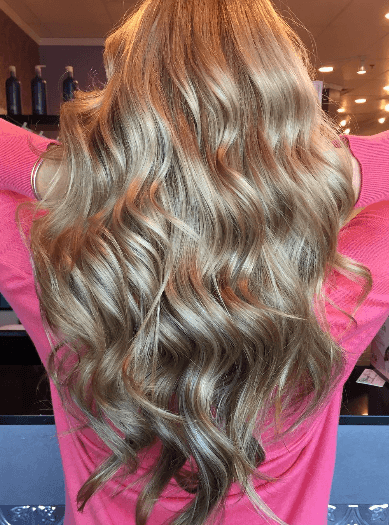Genius weft extensions creating thick luxurious human hair volume