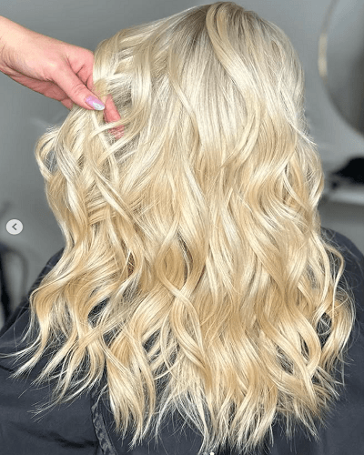 Blonde hair extensions with soft layered salon finish