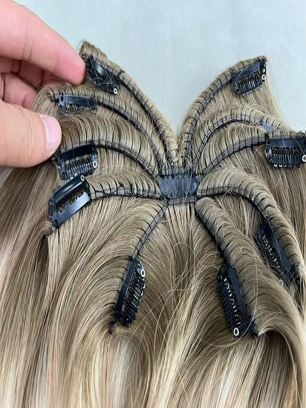 Clip-in human hair extensions set showing natural texture and color blend